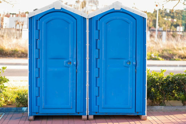 Side-by-side Blue Stand Alone Porta Potty Units